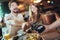 Couple using mobile phone and making contactless payment in a restaurant. S