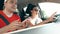 Couple using smartphone navigation app in the car on vacation