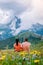 Couple on vacation hiking in the Italien Dolomites, Amazing view on Seceda peak. Trentino Alto Adige, Dolomites Alps