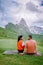 Couple on vacation hiking in the Italien Dolomites, Amazing view on Seceda peak. Trentino Alto Adige, Dolomites Alps