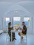 Couple on vacation in Santorini Greece, men and women having breakfast in a traditional dome house