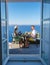 Couple on vacation in Santorini Greece, men and women having breakfast in a traditional dome house