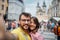 Couple in a vacation trip in city streets at Prague  on vacation making selfie