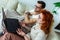 Couple after vaccination having medical teleconsultation using laptop at home