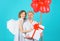 Couple in valentine day with heart balloons and gift. Family angels with present. Valentines Day Cupid.