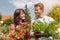 Couple in vegetable garden harvesting