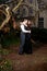 Couple in Victorian clothing embracing in the park