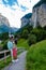 Couple visit Lauterbrunnen valley with waterfall and Swiss Alps in the background Switzerland