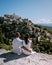 Couple visit the old town of Gordes Provence,Blooming purple lavender fields at Senanque monastery, Provence, southern