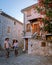Couple visit Ruoms, The medieval village of Ruoms with its old brick houses and small alleys on the Ardeche River in