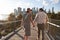 Couple Visiting New York With Manhattan Skyline In Background