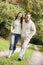 Couple on walk along woodland path