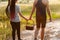 Couple walk informal meadow picnic love concept.