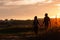 Couple walk informal meadow picnic love concept.