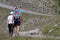 Couple of walkers on mountain paths in Chamrousse