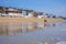 Couple walking along the beach at Lyme Regis, Dorset, England.