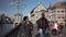 A couple walking along the Limmat riverside