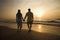 Couple Walking on Beach at Sunset