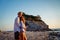 Couple walking on beach. Young happy people walking on beach smiling