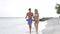 Couple Walking On Beautiful Beach