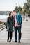 Couple walking on boardwalk stop for a kiss