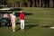 Couple walking on golf course