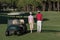 Couple walking on golf course