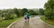 Couple walking hand in hand under umbrella in monsoon