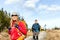 Couple walking and hiking on mountain trail