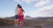 Couple walking holding hands on vacation in volcano mountains of Lanzarote