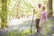 Couple walking outdoors with walking stick smiling