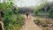 Couple walking through the ruins of the fortress stone castle.