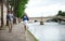 Couple is walking by the Seine