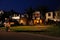 A couple walking on the street of a Upmarket wealthy suburban neighborhood in gated community estate at Night