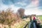 couple walking together on country lanes in winter