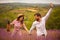 Couple walking trough lavender field.  Dancing love