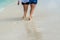 Couple walks along a paradisiacal Caribbean beach in Aruba