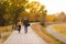 Couple walks in the park at sunset feeling loved