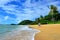 Couple walks on Trinity beach near Cairns Queensland Australia