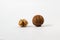 Couple of walnuts in their skins and peeled. Isolate white background