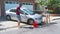 Couple washing car in driveway