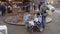 Couple watching kid playing with blocks on market