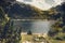 Couple watching the lake of Oule in the French Pyrenees