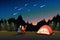 Couple Watching Meteor Shower While Camping