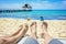 Couple watching their kids playing on the beach on vacation