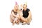 Couple wearing party hats with their dog seated on a floor