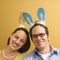 Couple wearing rabbit ears.