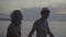 Couple wearing santa hat at the beach