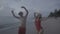 Couple wearing santa hat at the beach