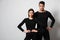 Couple wearing thermal underwear on grey background. Space for text